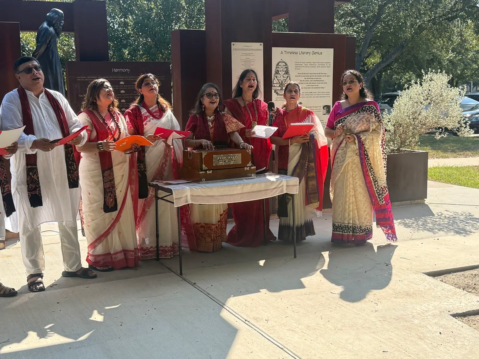 Community members in front of the memorial â An Inspiring Conversation with Dr. Rabindra Chakraborty