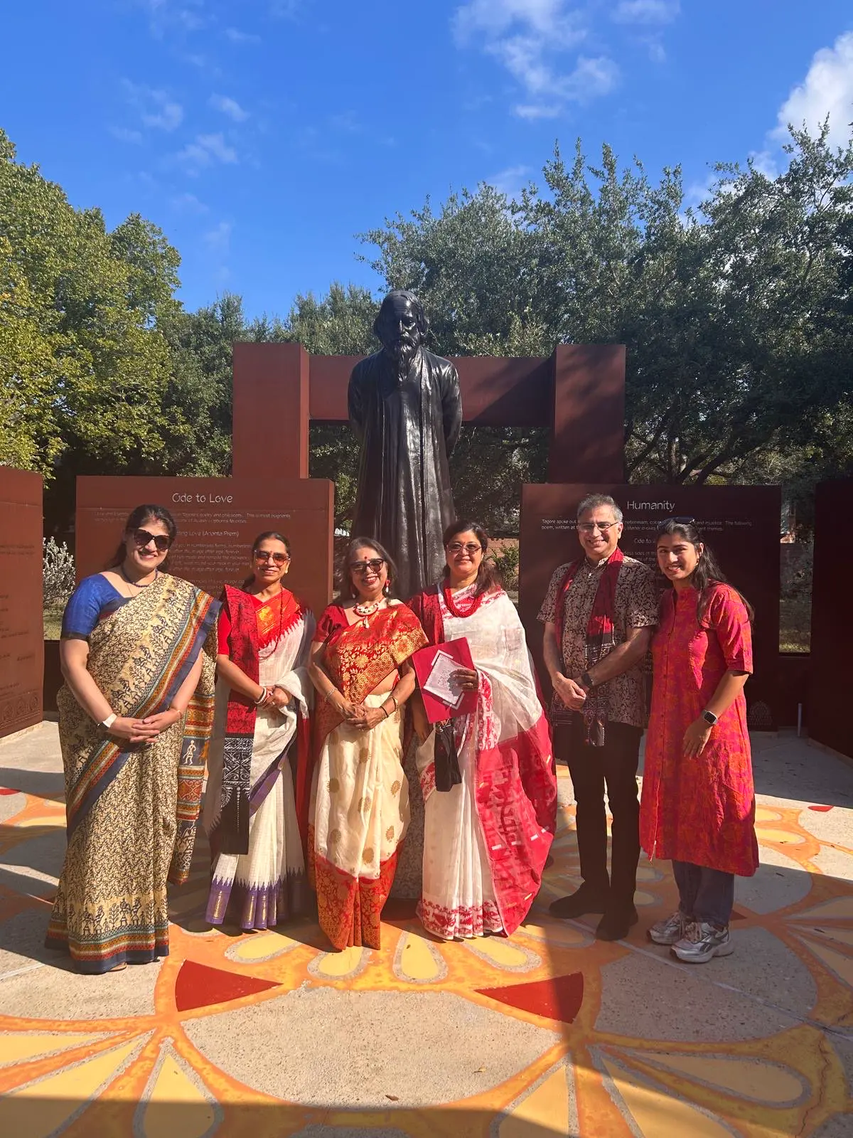 Community members beside the statue â An Inspiring Conversation with Dr. Rabindra Chakraborty