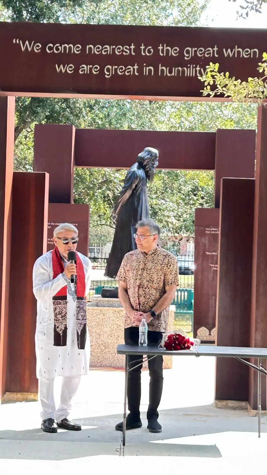 Speaker beside the tagore statue â An Inspiring Conversation with Dr. Rabindra Chakraborty